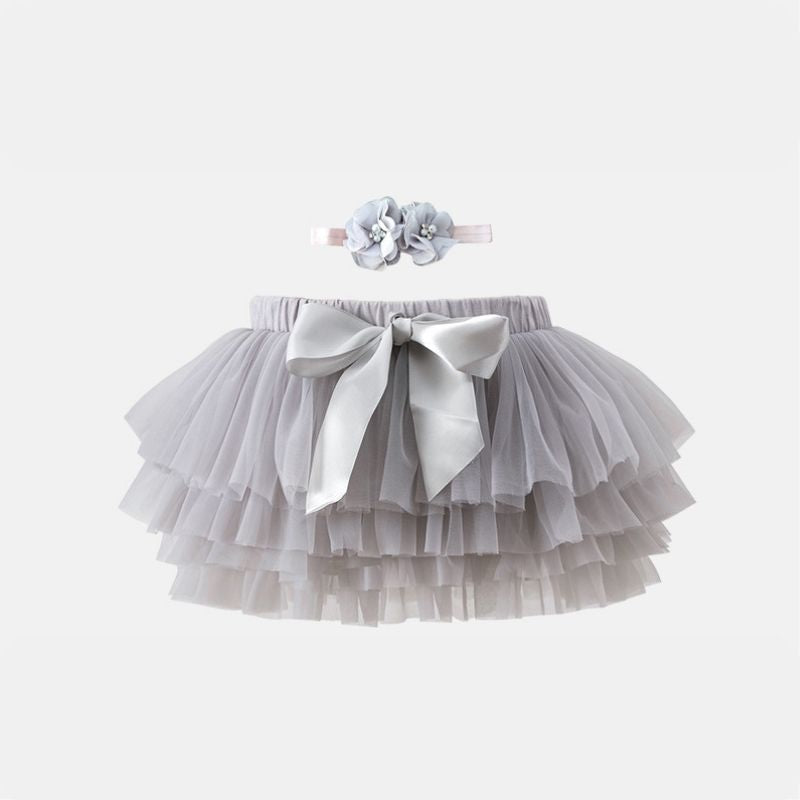 Sophisticated French Grey Tutu Skirt by Dear Pastel. Includes an adorable headband, and the soft tulle provides comfort for your baby.