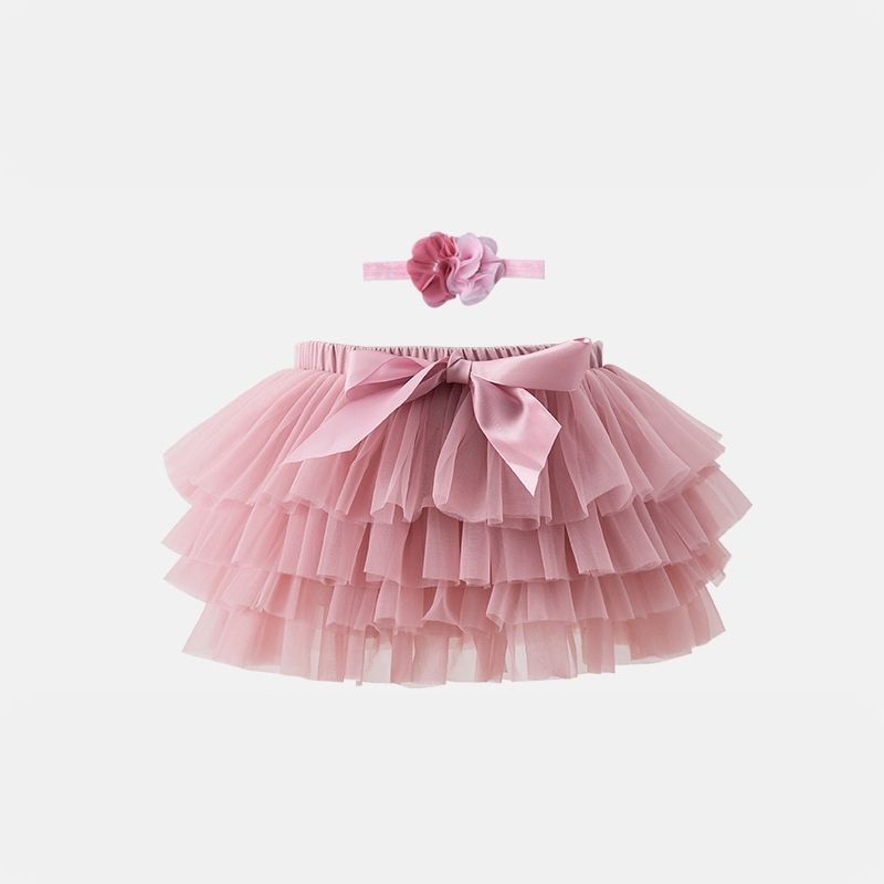 Elegant Pale Rose Tutu Skirt from Dear Pastel. Paired with a delightful headband, the ultra-soft tulle ensures comfort for your little one.