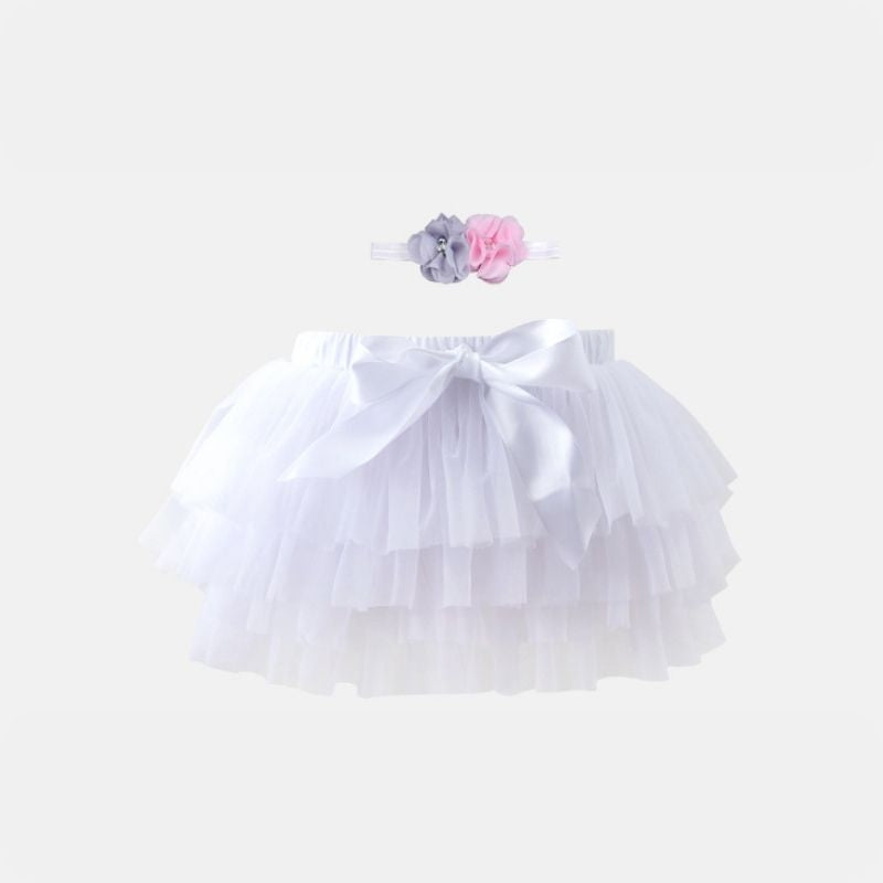 Classic White Tutu Skirt by Dear Pastel. Accompanied by a sweet headband, the gentle tulle fabric is perfect for your baby's delicate skin.